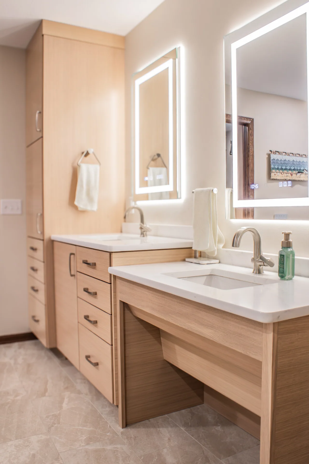 Bathroom vanity, illuminated mirror, and storage