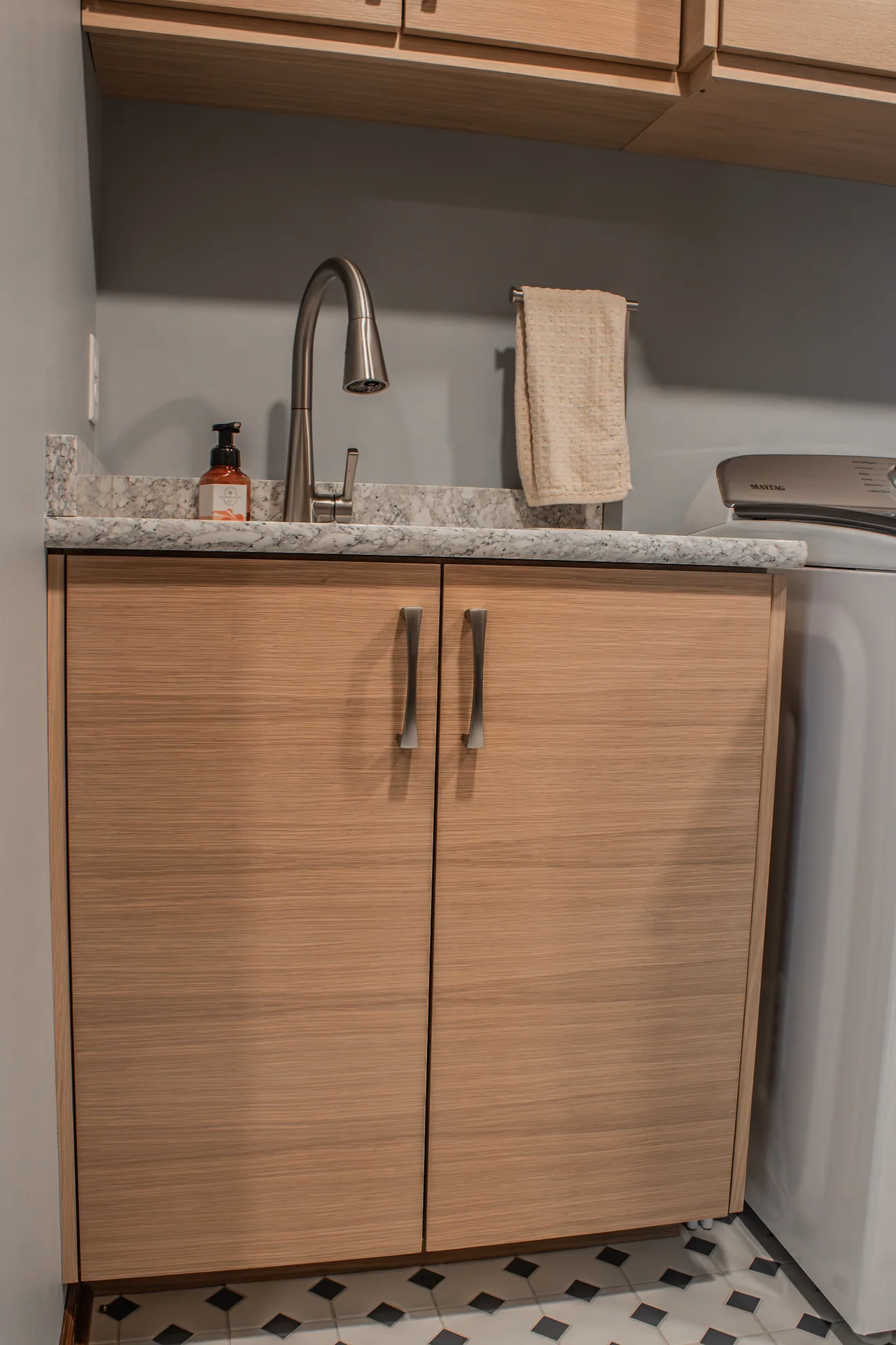 Laundry sink base and cabinet hardware